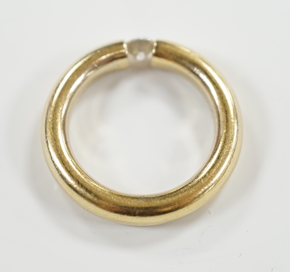 A modern 750 yellow metal and solitaire diamond set ring, size M, gross weight 6.1 grams, the stone measuring 4.1mm in diameter.